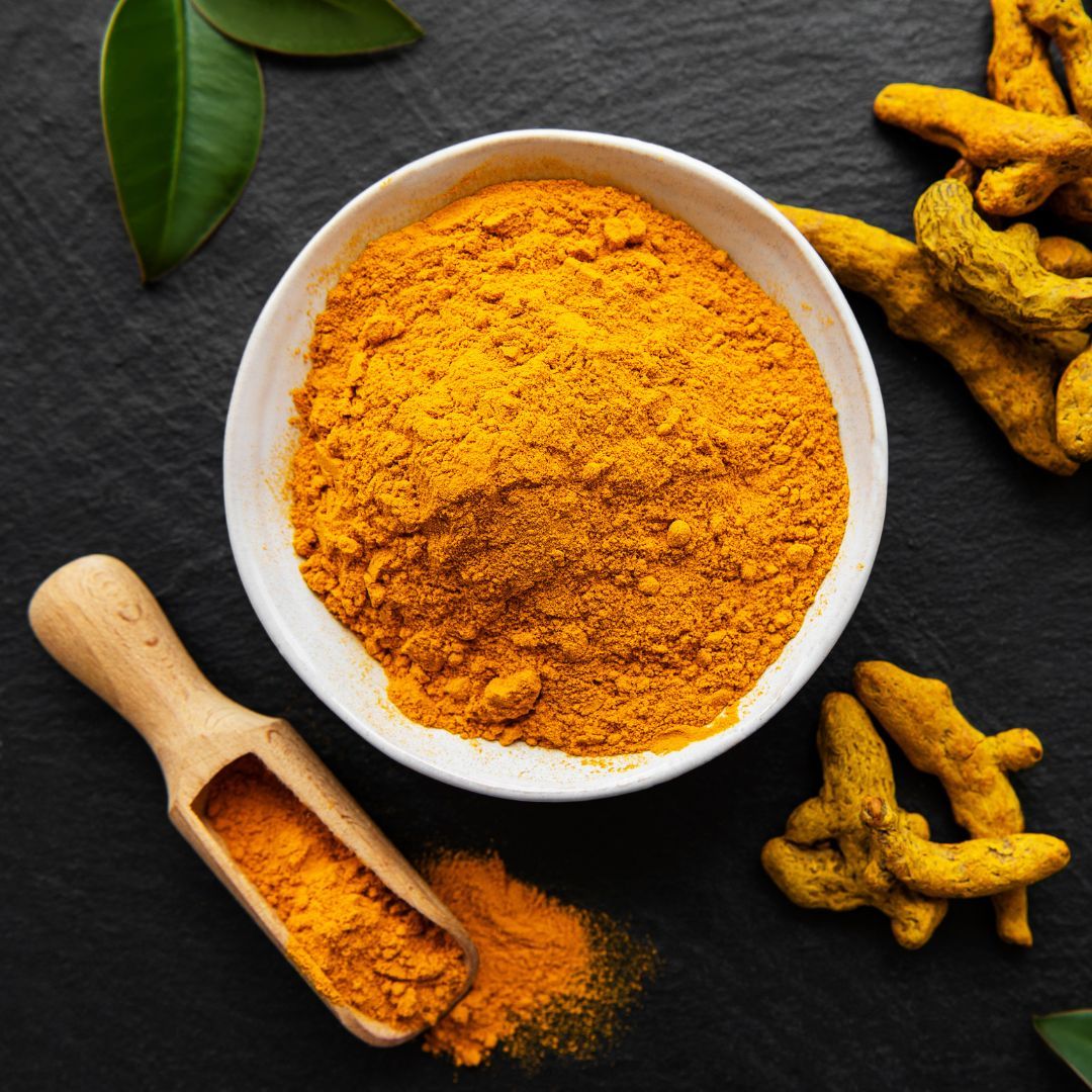 Golden turmeric roots and powder